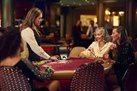 Live baccarat dealer and card table on cnnslot login