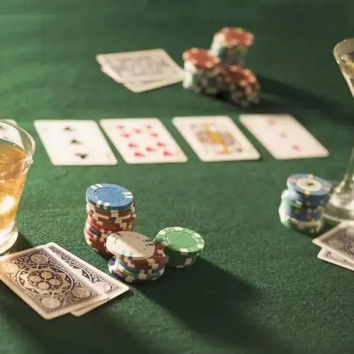 Live dealer shaking Sic Bo dice cup in multi-camera studio